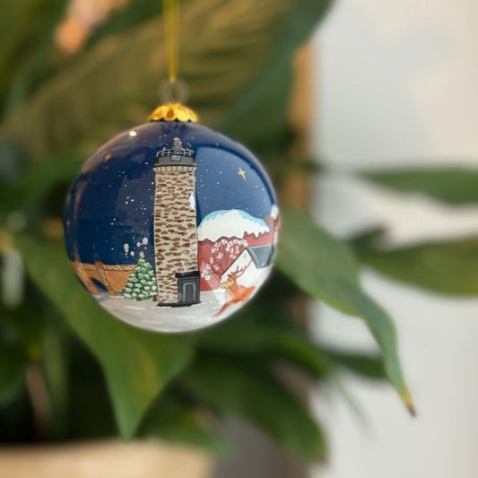 Hand-painted Scottish Christmas decoration bauble with lighthouse and winter scene